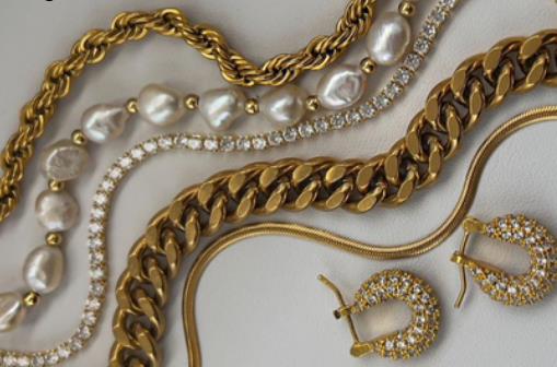 Gold chains and pearl strands laid flat